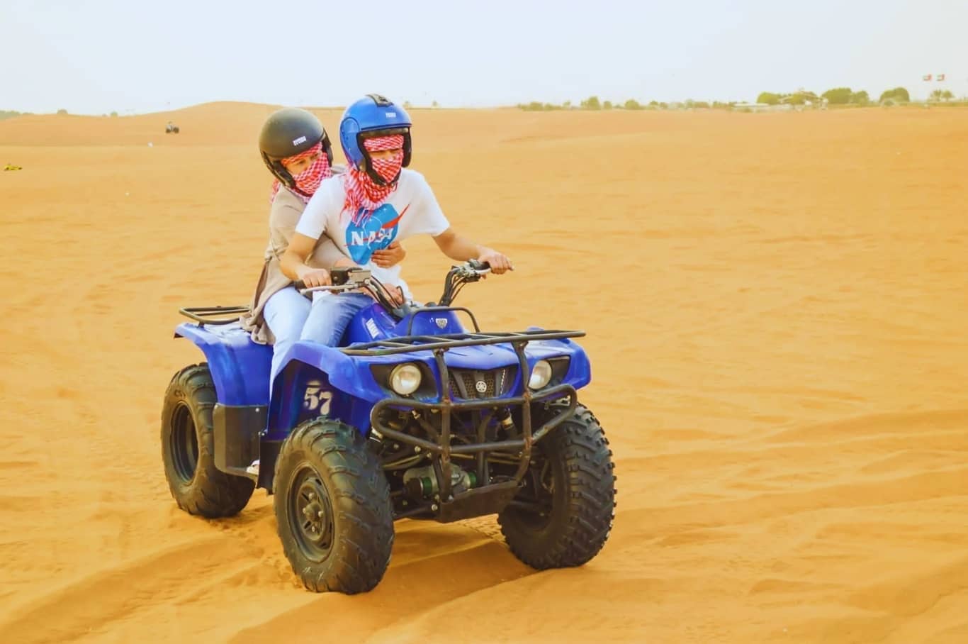 Desert Safari Dubai with Quad Bike, Camels Ride & BBQ Dinner quad biking in desert